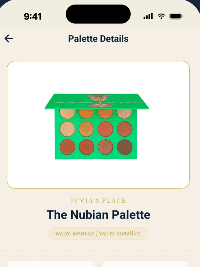 BeautySpark Palette Details screen showing a photo of the green Juvia's Place Nubian palette with its twelve warm pans, the brand line JUVIA'S PLACE, the title The Nubian Palette, and a 'warm neutrals / warm metallics' tag