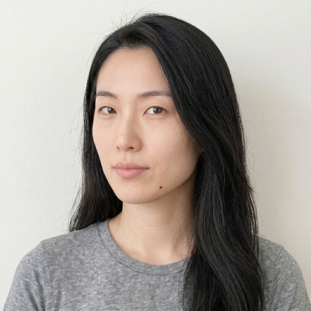 Selfie taken from above at an angle with head tilted creating uneven lighting across face