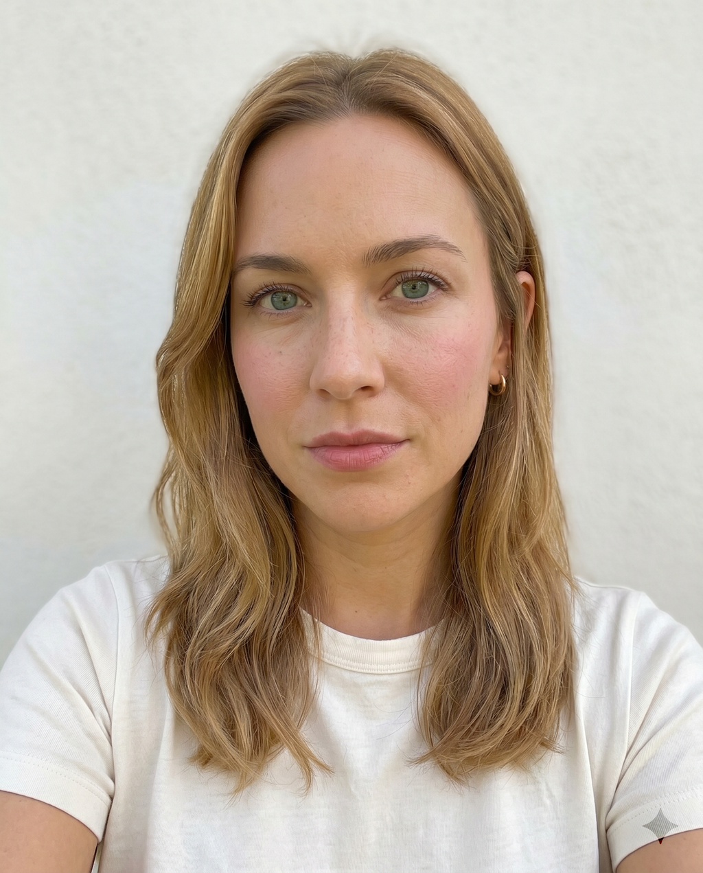 Selfie with visible foundation and concealer altering natural skin tone